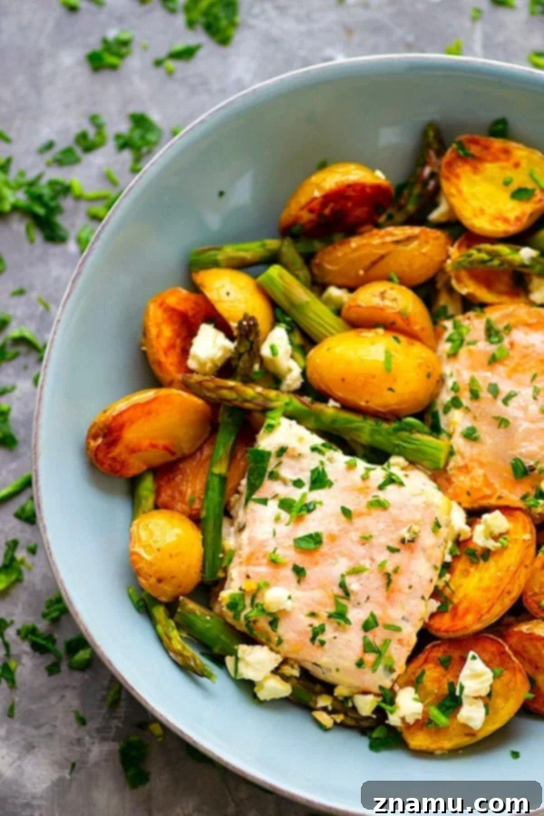 Sheet Pan Greek Salmon - Made entirely on one sheet pan and packed FULL of incredible Greek flavors, this Greek salmon and fingerling potatoes will quickly become a regular part of the dinner rotation!