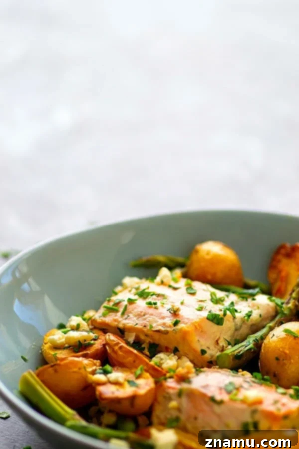 Sheet Pan Greek Salmon - Made entirely on one sheet pan and packed FULL of incredible Greek flavors, this Greek salmon and fingerling potatoes will quickly become a regular part of the dinner rotation!