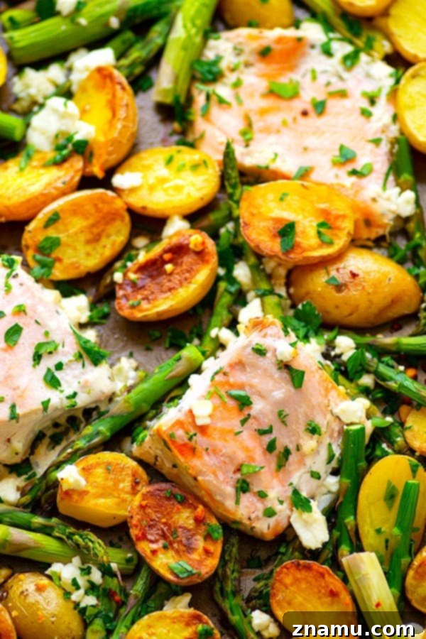 Sheet Pan Greek Salmon - Made entirely on one sheet pan and packed FULL of incredible Greek flavors, this Greek salmon and fingerling potatoes will quickly become a regular part of the dinner rotation!