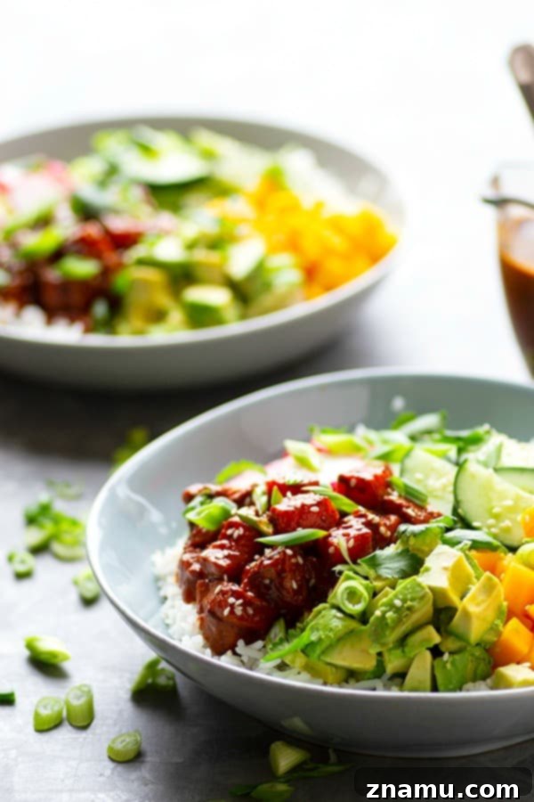 Delicious Spicy Ginger Mango Salmon Poke Bowls with fresh ingredients