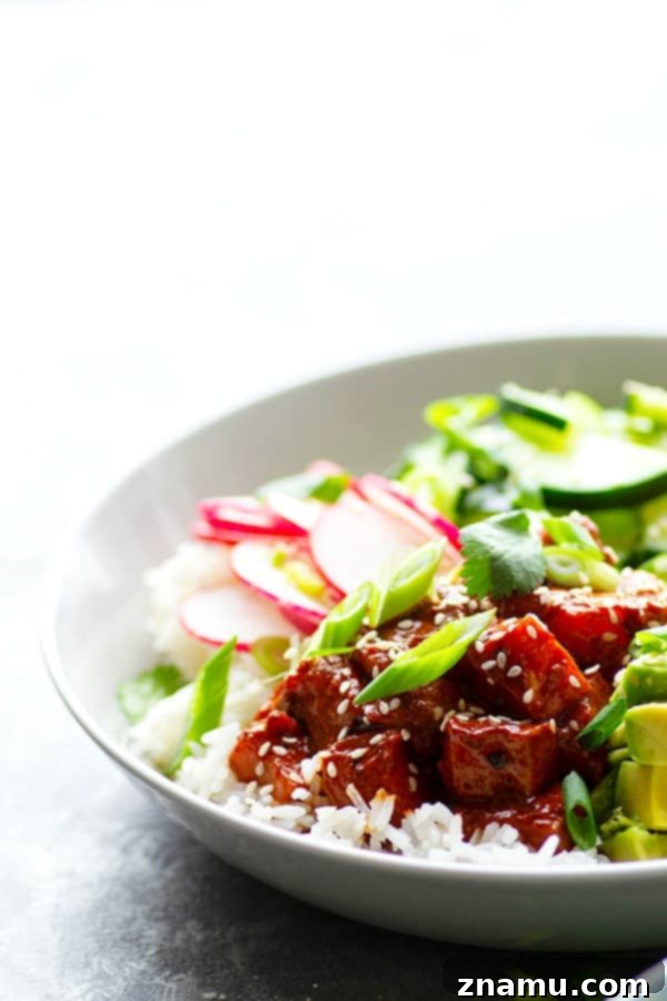 Beautifully arranged Spicy Ginger Mango Salmon Poke Bowl