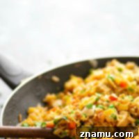 Cilantro lime marinated chicken is the secret behind what makes this cilantro lime chicken fried rice SO incredibly flavorful.--You'll love this fried rice more than your favorite Chinese place!