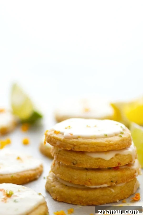 Zesty Brown Butter Shortbread 4 Stack of small, glazed citrus browned butter shortbread cookies ready for serving.