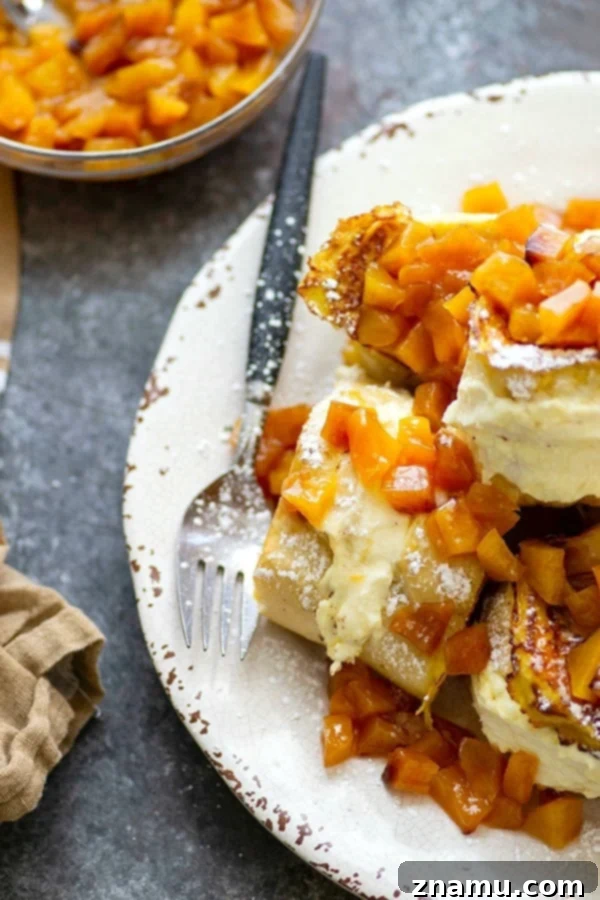 Peaches and Cream Cheese Stuffed French Toast 2 Stuffed with a tangy cream cheese filling and topped with a sweet peach compote, this stuffed french toast is a stunner for any brunch and on the table in minutes!