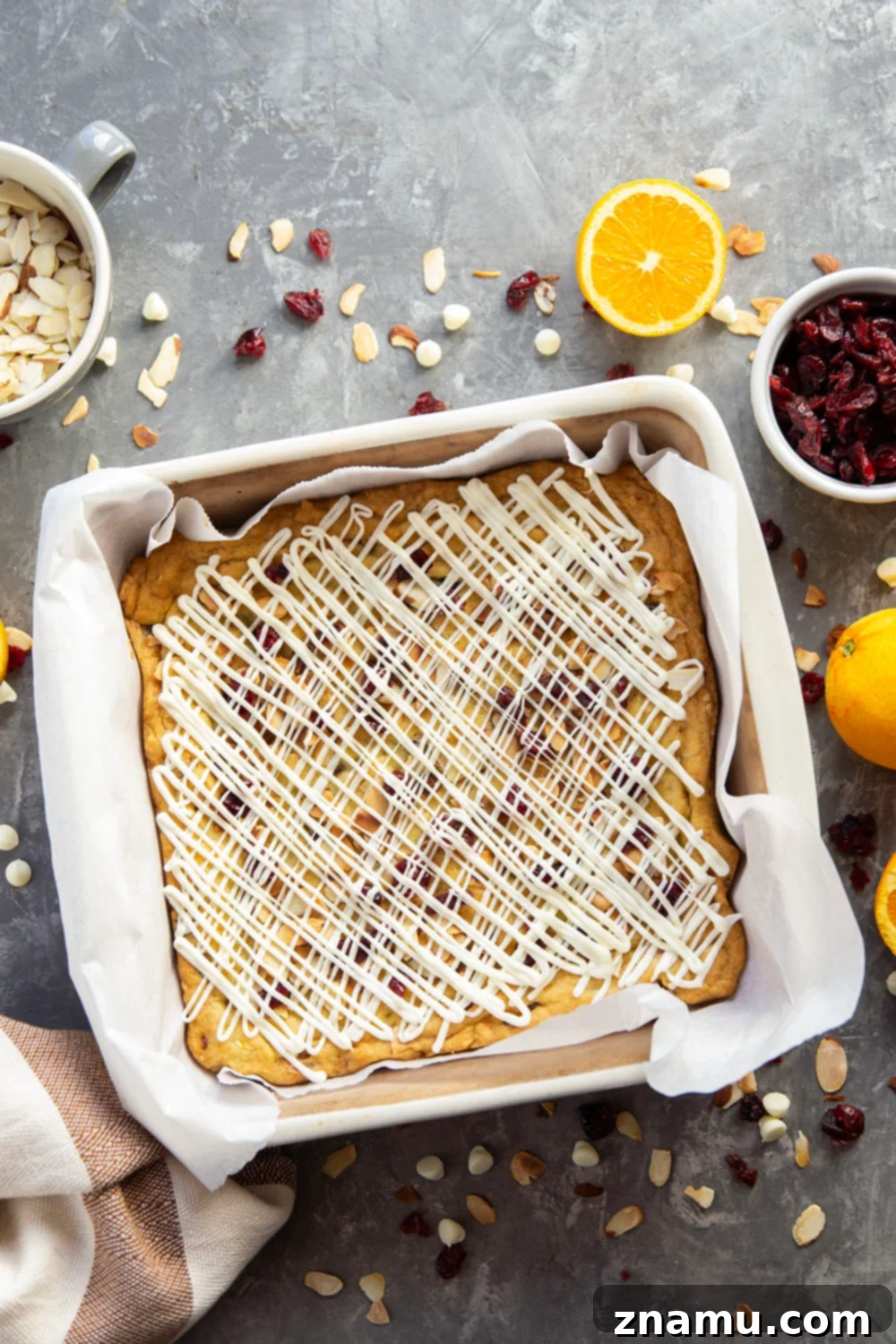 Buttery Cranberry Almond Bars 3 Delicious cranberry almond bars cooling on a wire rack, showcasing their golden-brown edges and festive toppings.