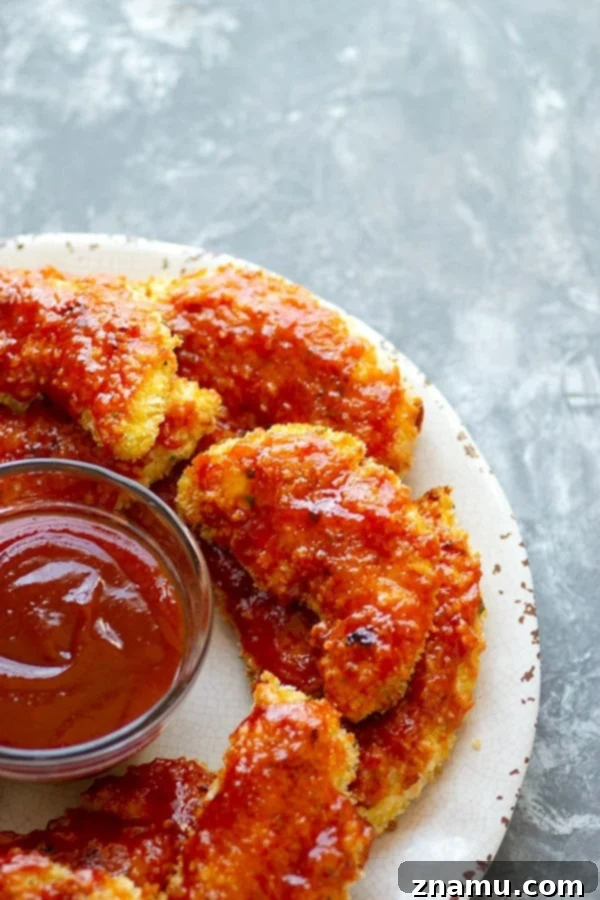 Hawaiian Baked BBQ Chicken Strips 4 Super crispy and coated in a sweet pineapple barbecue sauce, these Hawaiian-style oven baked BBQ chicken tenders will become an instant weeknight dinner hit!
