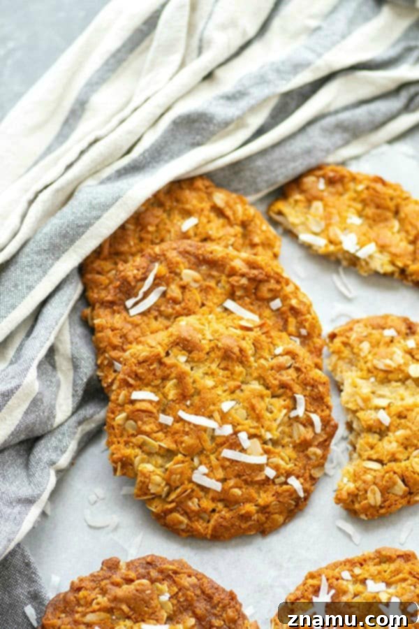 Close-up of baked Anzac Biscuits showing their golden brown color and texture.