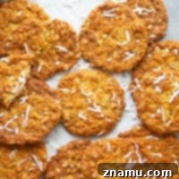 Classic Anzac Biscuits featuring a crisp and chewy texture with coconut and oats.