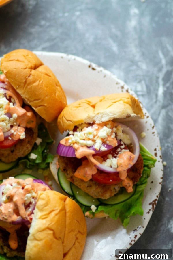Mediterranean Chicken Burgers with Smoky Red Pepper Tzatziki 4 Grilled chicken burgers are piled high with fresh Greek toppings and a creamy red roasted red pepper tzatziki sauce for an incredibly flavorful Greek twist on burgers!