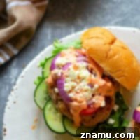 Mediterranean Chicken Burgers with Smoky Red Pepper Tzatziki 7 Grilled chicken burgers are piled high with fresh Greek toppings and a creamy red roasted red pepper tzatziki sauce for an incredibly flavorful Greek twist on burgers!