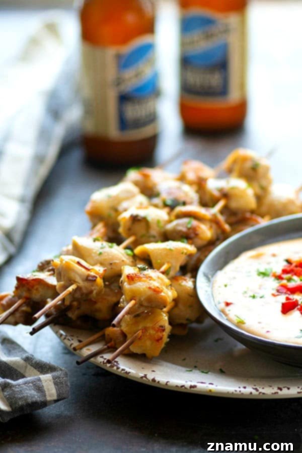 Bira Terbiyeli Tavuk Şişleri, Acı Pimento Peynir Sosu Eşliğinde 3 Incredibly juicy and flavorful beer marinated chicken kabobs are quick to throw on the grill for any cookout! Paired with a spicy pimento cheese dip, these chicken kabobs will quickly become a cookout staple.