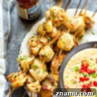 Incredibly juicy and flavorful beer marinated chicken kabobs are quick to throw on the grill for any cookout! Paired with a spicy pimento cheese dip, these chicken kabobs will quickly become a cookout staple.
