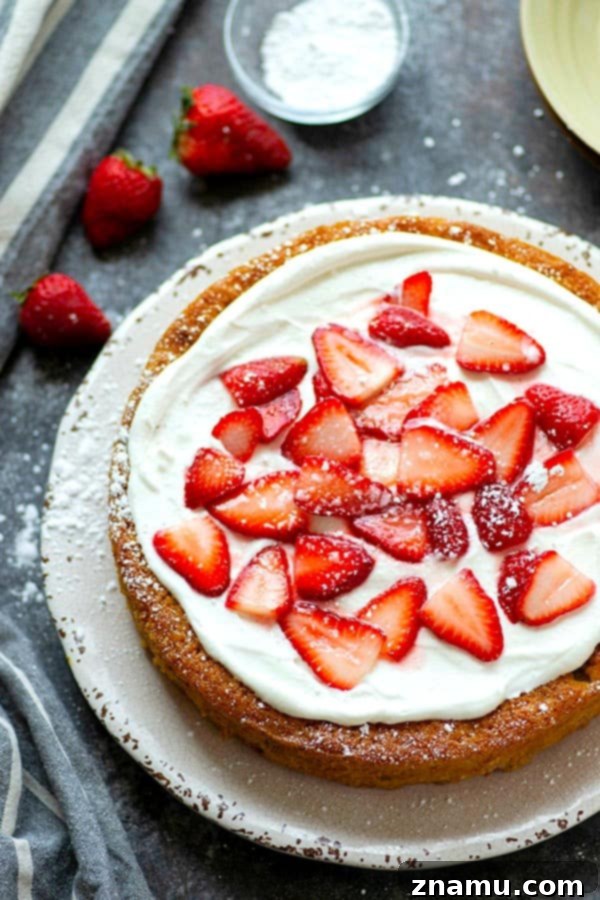 Nutty Butter Strawberry Cornmeal Cake 3 Close-up of strawberry cornmeal cake slice with cream