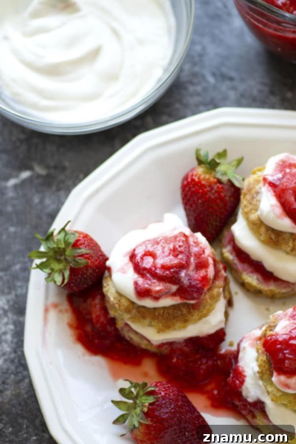 Strawberry Rhubarb Shortcake with Bright Honey Lemon Whipped Cream 5 Homemade strawberry rhubarb shortcake, layered with creamy whipped topping, ready to be served.