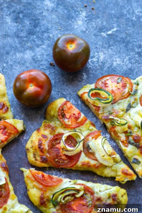 Mediterranean Heirloom Tomato Flatbread with Zucchini, Pesto, and Mozzarella 2 Tender zucchini, flavorful pesto, and juicy summer heirloom tomatoes make for the perfect summer-style pesto flatbread!