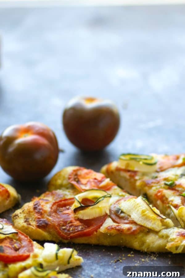 Mediterranean Heirloom Tomato Flatbread with Zucchini, Pesto, and Mozzarella 4 Tender zucchini, flavorful pesto, and juicy summer heirloom tomatoes make for the perfect summer-style pesto flatbread!
