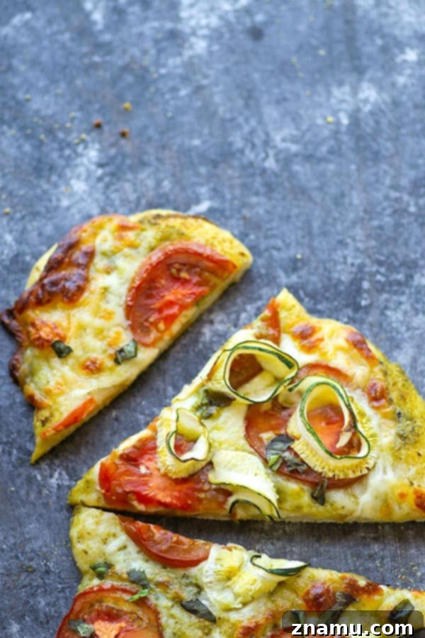 Mediterranean Heirloom Tomato Flatbread with Zucchini, Pesto, and Mozzarella 5 Tender zucchini, flavorful pesto, and juicy summer heirloom tomatoes make for the perfect summer-style pesto flatbread!