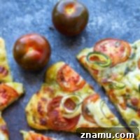 Mediterranean Heirloom Tomato Flatbread with Zucchini, Pesto, and Mozzarella 7 Tender zucchini, flavorful pesto, and juicy summer heirloom tomatoes make for the perfect summer-style pesto flatbread!