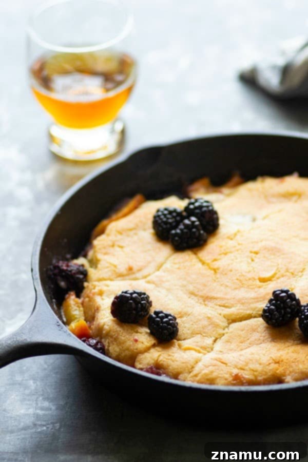 Brandied Peach & Blackberry Cobbler 3 Classic peach blackberry cobbler is the ultimate dessert ode to summer! Flavorful brandy is tossed in the fruit filling with even more brushed on top hot from oven. Serve this beautiful cobbler with plenty of vanilla ice cream!