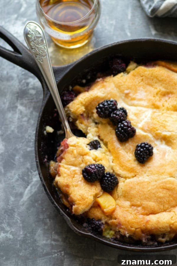 Brandied Peach & Blackberry Cobbler 4 Classic peach blackberry cobbler is the ultimate dessert ode to summer! Flavorful brandy is tossed in the fruit filling with even more brushed on top hot from oven. Serve this beautiful cobbler with plenty of vanilla ice cream!