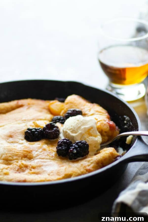 Brandied Peach & Blackberry Cobbler 5 Classic peach blackberry cobbler is the ultimate dessert ode to summer! Flavorful brandy is tossed in the fruit filling with even more brushed on top hot from oven. Serve this beautiful cobbler with plenty of vanilla ice cream!