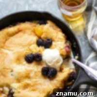 Brandied Peach & Blackberry Cobbler 7 Classic peach blackberry cobbler is the ultimate dessert ode to summer! Flavorful brandy is tossed in the fruit filling with even more brushed on top hot from oven. Serve this beautiful cobbler with plenty of vanilla ice cream!
