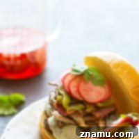 Green chile cheeseburgers are piled high with flavorful roasted chiles, tender shiitake mushrooms, and crispy bacon for the ultimate take on this burger classic!