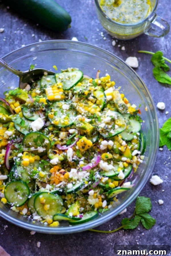 Charred sweet corn, silky avocado, and crisp cucumbers are tossed in a flavorful feta mint dressing for the most incredible summer twist on cucumber salad!
