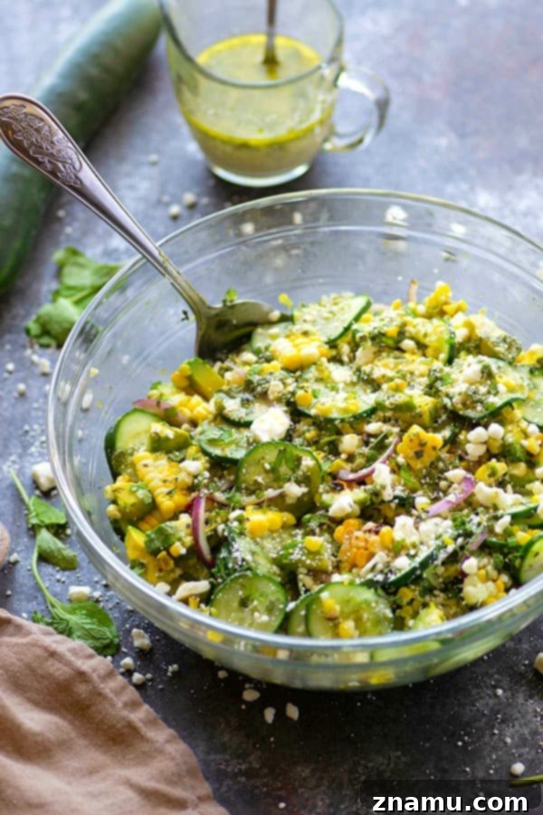 Charred sweet corn, silky avocado, and crisp cucumbers are tossed in a flavorful feta mint dressing for the most incredible summer twist on cucumber salad!