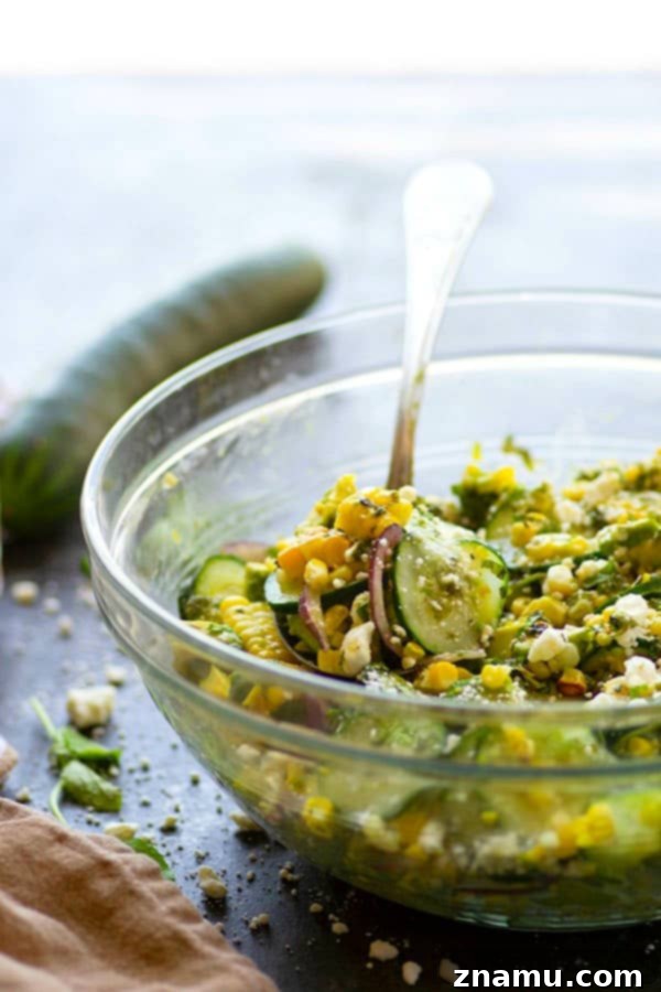 Charred sweet corn, silky avocado, and crisp cucumbers are tossed in a flavorful feta mint dressing for the most incredible summer twist on cucumber salad!