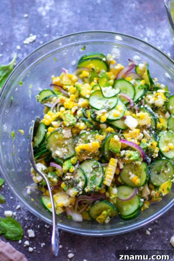Charred sweet corn, silky avocado, and crisp cucumbers are tossed in a flavorful feta mint dressing for the most incredible summer twist on cucumber salad!