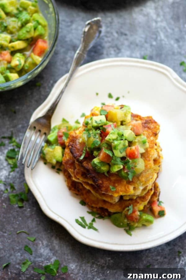 Spicy Sweet Corn Fritters with Tangy Tomatillo Avocado Salsa 3 Perfectly crispy and golden sweet corn fritters are spiced up with roasted green chiles and an incredibly flavorful tomatillo avocado salsa piled on top!