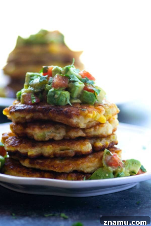 Spicy Sweet Corn Fritters with Tangy Tomatillo Avocado Salsa 4 Perfectly crispy and golden sweet corn fritters are spiced up with roasted green chiles and an incredibly flavorful tomatillo avocado salsa piled on top!