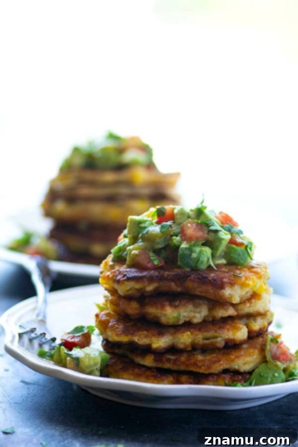 Spicy Sweet Corn Fritters with Tangy Tomatillo Avocado Salsa 5 Perfectly crispy and golden sweet corn fritters are spiced up with roasted green chiles and an incredibly flavorful tomatillo avocado salsa piled on top!