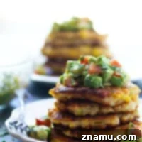 Spicy Sweet Corn Fritters with Tangy Tomatillo Avocado Salsa 7 Perfectly crispy and golden sweet corn fritters are spiced up with roasted green chiles and an incredibly flavorful tomatillo avocado salsa piled on top!