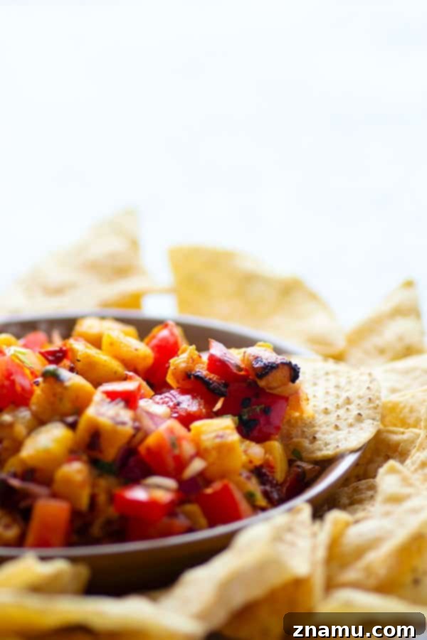 Sweet Heat Chipotle Pineapple Salsa 4 Sweet grilled pineapple and smoky chipotle pepper take this addicting grilled pineapple salsa to an incredible level of flavors! Serve with your favorite chips, on tacos, or over grilled meat.