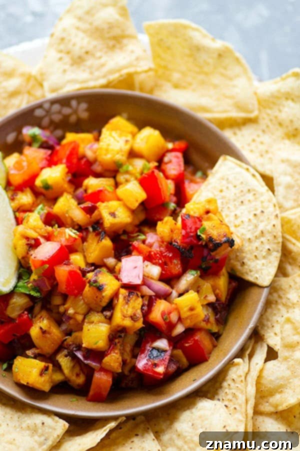 Sweet Heat Chipotle Pineapple Salsa 5 Sweet grilled pineapple and smoky chipotle pepper take this addicting grilled pineapple salsa to an incredible level of flavors! Serve with your favorite chips, on tacos, or over grilled meat.