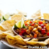 Sweet grilled pineapple and smoky chipotle pepper take this addicting grilled pineapple salsa to an incredible level of flavors! Serve with your favorite chips, on tacos, or over grilled meat.