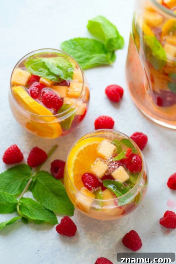 Refreshing Cantaloupe Raspberry Mint Moscato Sangria 3 Sweet moscato sangria is livened up with the addition of fresh cantaloupe, tangy raspberries, and refreshing mint leaves.