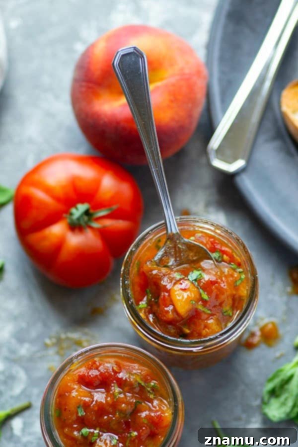 Basil Peach Heirloom Tomato Jam 3 Fresh basil and juicy sweet peaches add the perfect summer touch to this heirloom tomato jam! Wonderful spread on a toasted baguette and an incredible condiment for a charcuterie board.