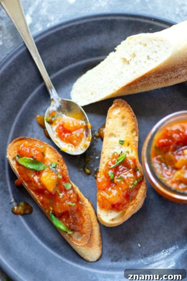 Basil Peach Heirloom Tomato Jam 5 Fresh basil and juicy sweet peaches add the perfect summer touch to this heirloom tomato jam! Wonderful spread on a toasted baguette and an incredible condiment for a charcuterie board.