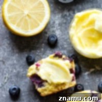 Blueberry cornbread muffins are incredibly soft inside, loaded with juicy blueberries, and heavenly slathered with a sweet lemon honey butter!