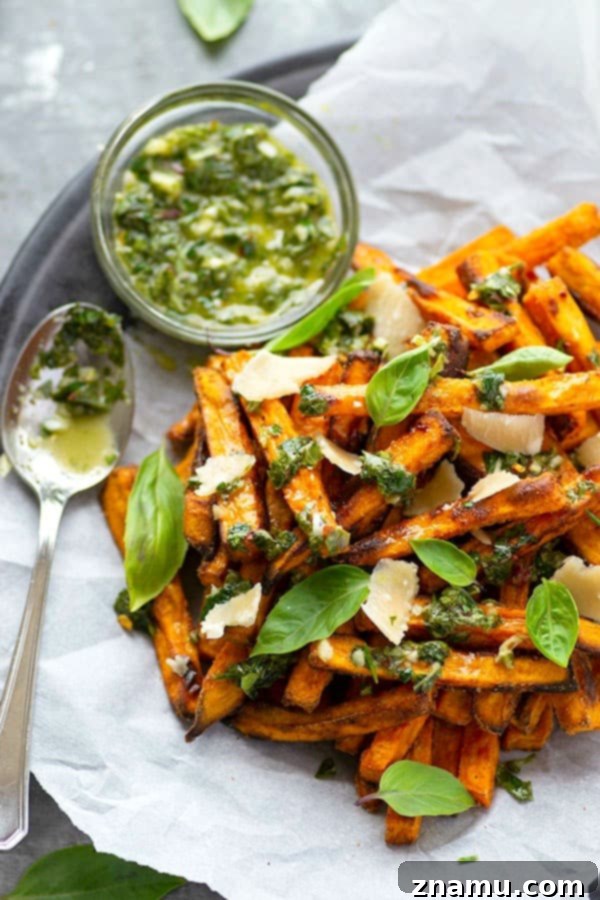Basil Chimichurri Sweet Potato Crunch 2 Perfectly crispy baked sweet potato fries are drizzled in a flavorful basil chimichurri sauce and topped with Parmesan cheese shards for a healthier appetizer or side dish!