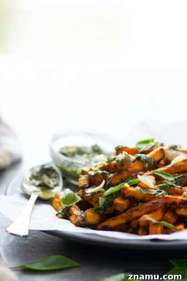 Basil Chimichurri Sweet Potato Crunch 3 Perfectly crispy baked sweet potato fries are drizzled in a flavorful basil chimichurri sauce and topped with Parmesan cheese shards for a healthier appetizer or side dish!