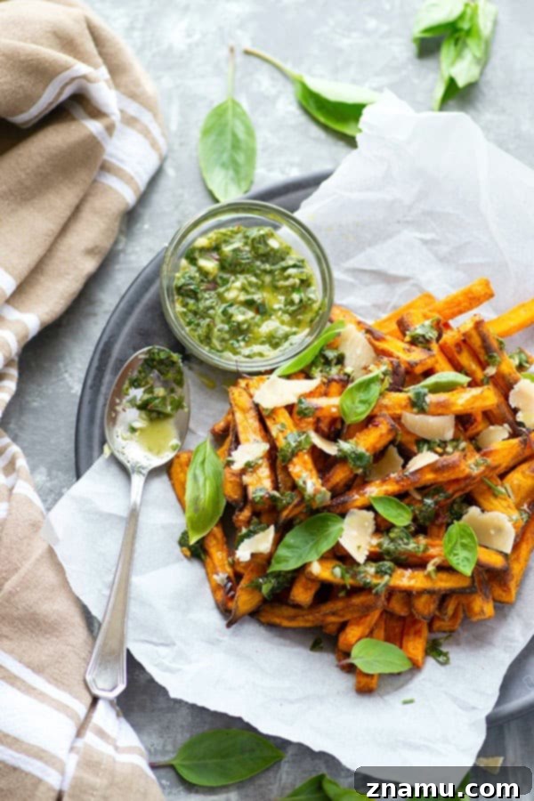 Basil Chimichurri Sweet Potato Crunch 5 Perfectly crispy baked sweet potato fries are drizzled in a flavorful basil chimichurri sauce and topped with Parmesan cheese shards for a healthier appetizer or side dish!