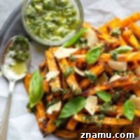Basil Chimichurri Sweet Potato Crunch 7 Perfectly crispy baked sweet potato fries are drizzled in a flavorful basil chimichurri sauce and topped with Parmesan cheese shards for a healthier appetizer or side dish!