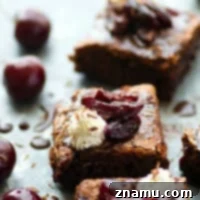 These black forest cherry brownies feature a fudgy brownie base swirled with cherry preserves and topped with whipped cream and extra cherries. -- The perfect crowd-pleaser dessert!