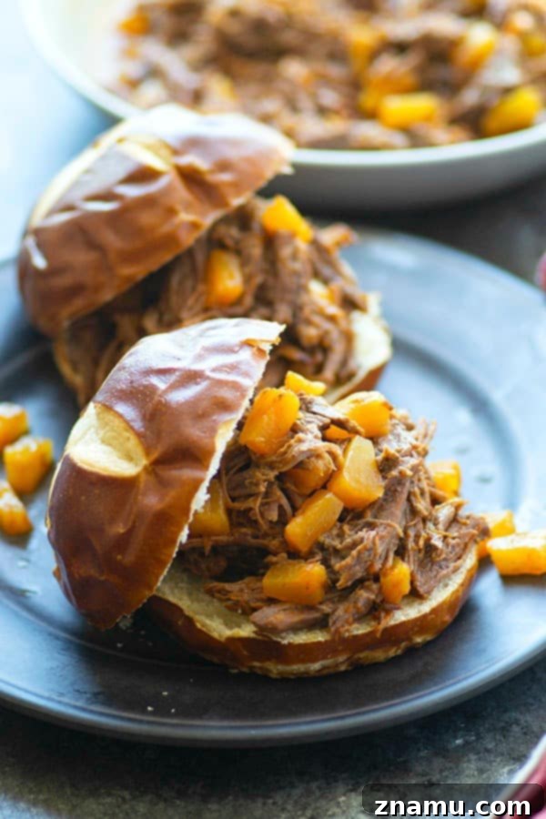 Tropical Instant Pot BBQ Beef Sandwiches 5 A serving of shredded Instant Pot Pineapple BBQ Beef ready for assembly into sandwiches.