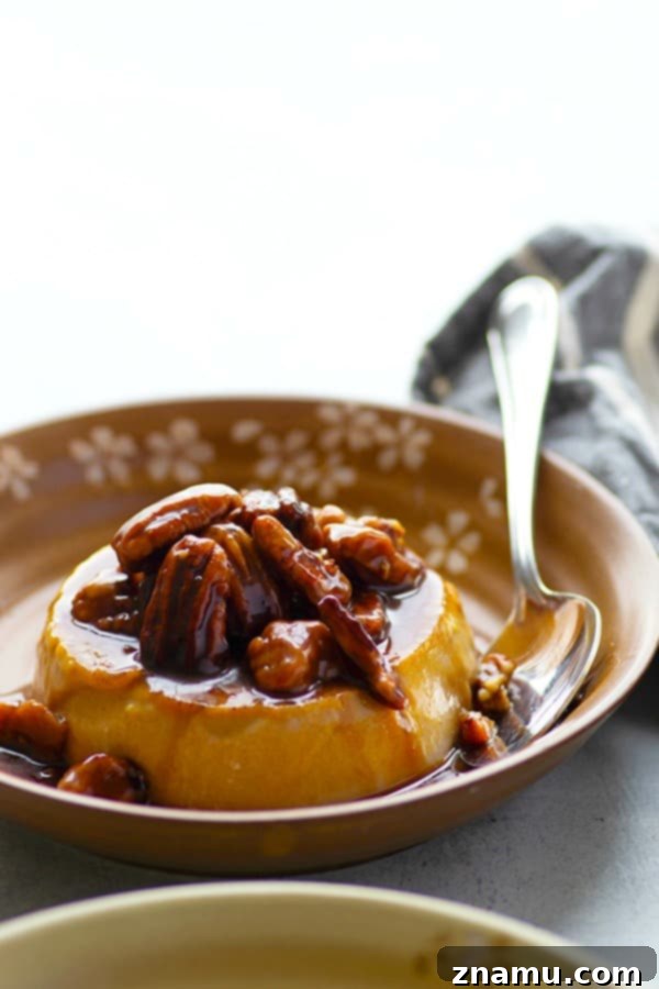 Autumn Spice Panna Cotta with Salted Pecan Caramel 3 Close-up of a pumpkin panna cotta, showcasing its smooth texture and rich color, before the sauce is added.