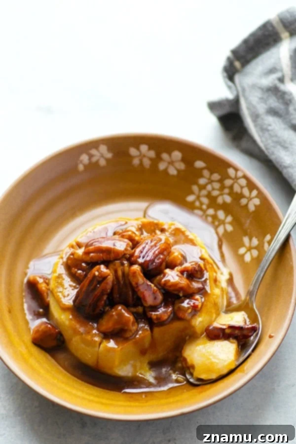 Autumn Spice Panna Cotta with Salted Pecan Caramel 4 Pumpkin panna cotta in a ramekin, generously topped with a glistening salted caramel pecan sauce and extra pecans.